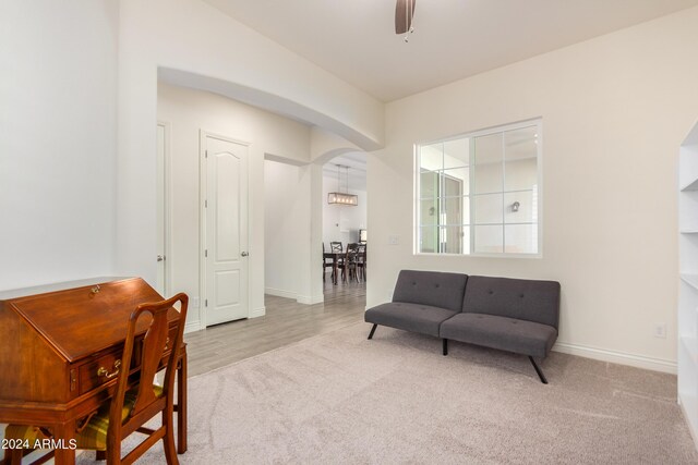 sitting room featuring ceiling fan and light hardwood / wood-style floors