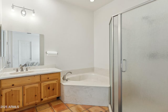 ensuite bathroom featuring a bath, a stall shower, vanity, and ensuite bath