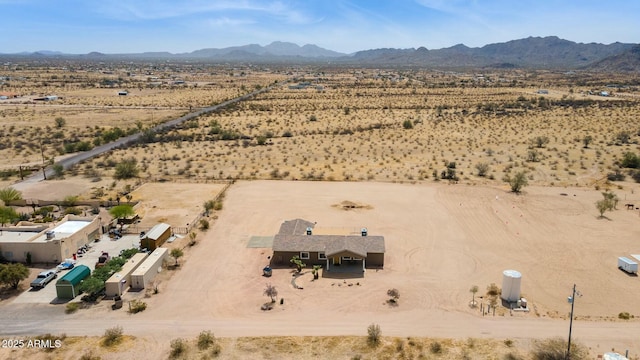 drone / aerial view with a mountain view and view of desert