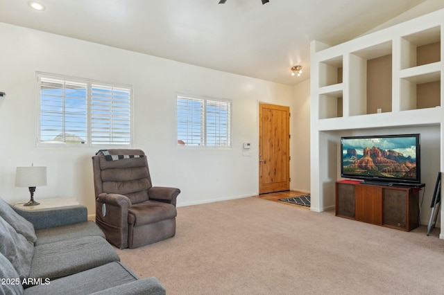 carpeted living area with recessed lighting, ceiling fan, baseboards, and a healthy amount of sunlight