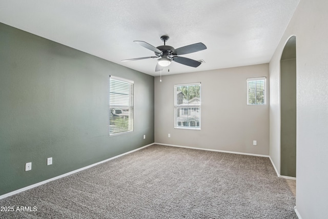2947 N Evergreen St, Buckeye, AZ 85396 - unfurnished room with carpet, ceiling fan, and arched walkways