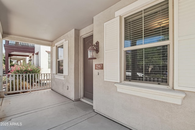 2947 N Evergreen St, Buckeye, AZ 85396 - property entrance featuring a porch and stucco siding