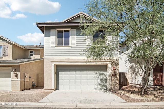 2947 N Evergreen St, Buckeye, AZ 85396 - view of front of house with a garage, driveway, and stucco siding