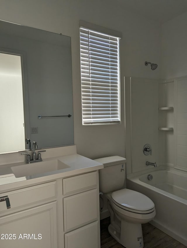 4330 N 94th Ave, Phoenix, AZ 85037 - bathroom with shower / washtub combination, toilet, vanity, and wood finished floors