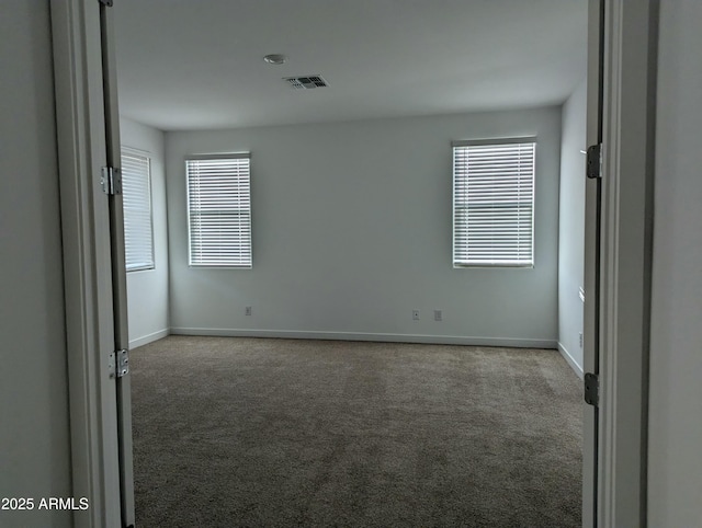 4330 N 94th Ave, Phoenix, AZ 85037 - carpeted spare room with visible vents and baseboards