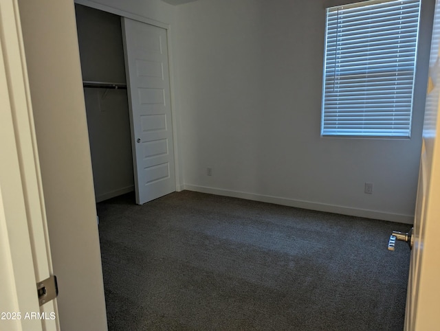 4330 N 94th Ave, Phoenix, AZ 85037 - unfurnished bedroom featuring carpet flooring, baseboards, and a closet