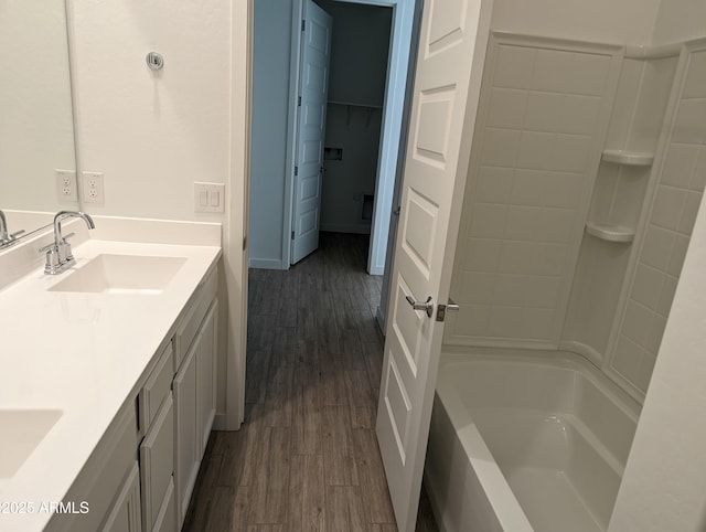 4330 N 94th Ave, Phoenix, AZ 85037 - bathroom with double vanity, wood finished floors, tub / shower combination, and a sink