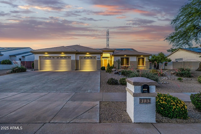 8132 W Hatfield Rd, Peoria, AZ 85383 - prairie-style house with a garage, driveway, stucco siding, and a tile roof