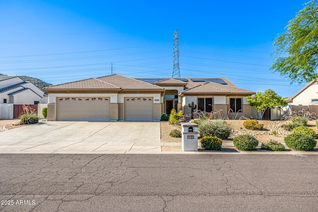 8132 W Hatfield Rd, Peoria, AZ 85383 - view of front of home with stucco siding, a garage, concrete driveway, solar panels, and a tile roof