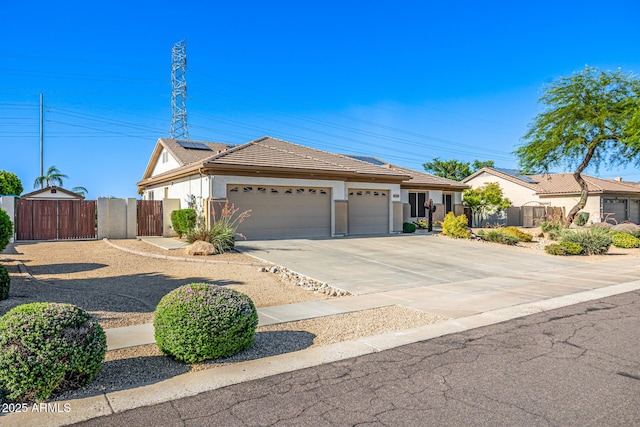8132 W Hatfield Rd, Peoria, AZ 85383 - ranch-style house with a gate, stucco siding, a garage, roof mounted solar panels, and driveway