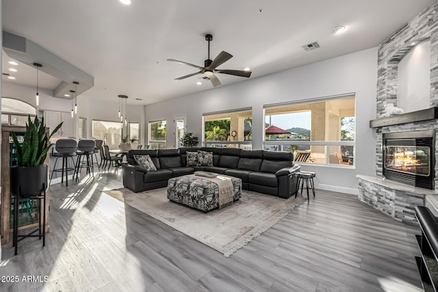 8132 W Hatfield Rd, Peoria, AZ 85383 - living area with a ceiling fan, a fireplace, wood finished floors, and recessed lighting