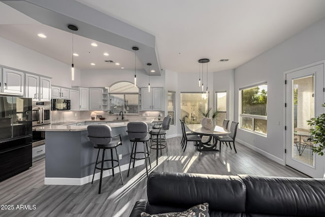 8132 W Hatfield Rd, Peoria, AZ 85383 - living area with wood finished floors and recessed lighting