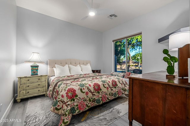 8132 W Hatfield Rd, Peoria, AZ 85383 - bedroom featuring wood finished floors, a ceiling fan, and access to outside