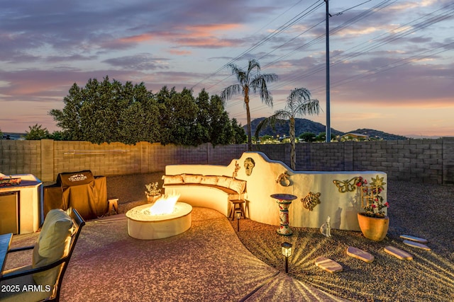 8132 W Hatfield Rd, Peoria, AZ 85383 - fenced backyard with a fire pit and a patio area