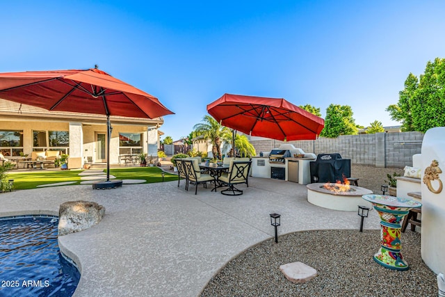 8132 W Hatfield Rd, Peoria, AZ 85383 - fenced backyard featuring area for grilling, a fire pit, a patio, and outdoor dining area