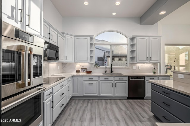 8132 W Hatfield Rd, Peoria, AZ 85383 - kitchen featuring black appliances, open shelves, recessed lighting, decorative backsplash, and white cabinetry