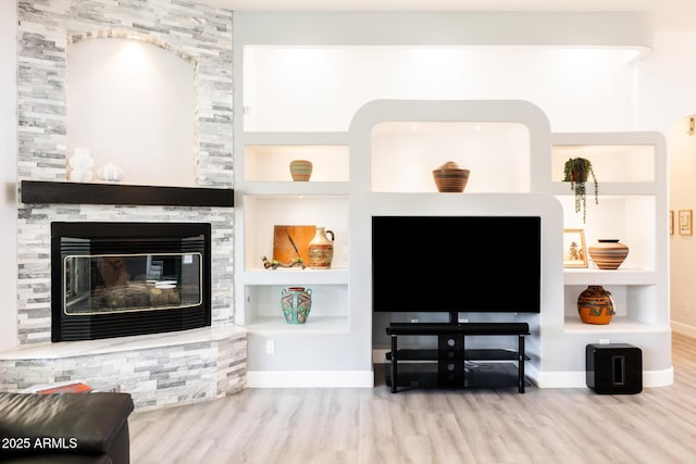 8132 W Hatfield Rd, Peoria, AZ 85383 - living area with wood finished floors, built in features, and a stone fireplace