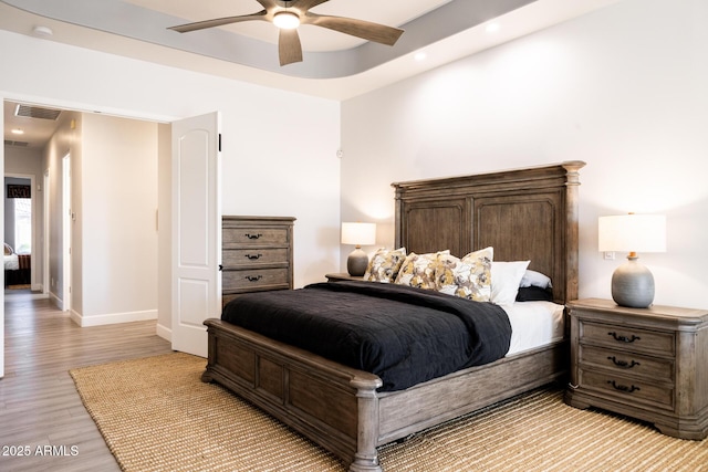 8132 W Hatfield Rd, Peoria, AZ 85383 - bedroom with light wood finished floors, recessed lighting, and ceiling fan