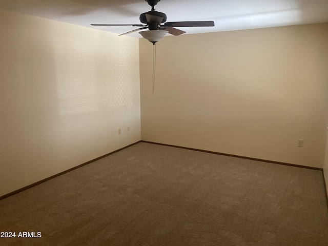 carpeted empty room with ceiling fan