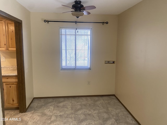 spare room featuring ceiling fan