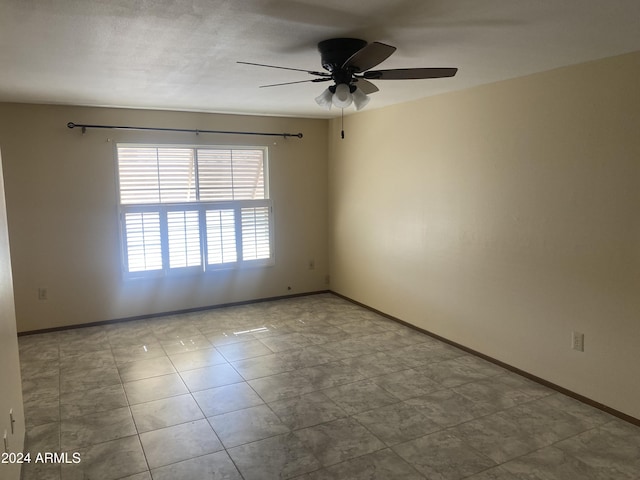 spare room with ceiling fan