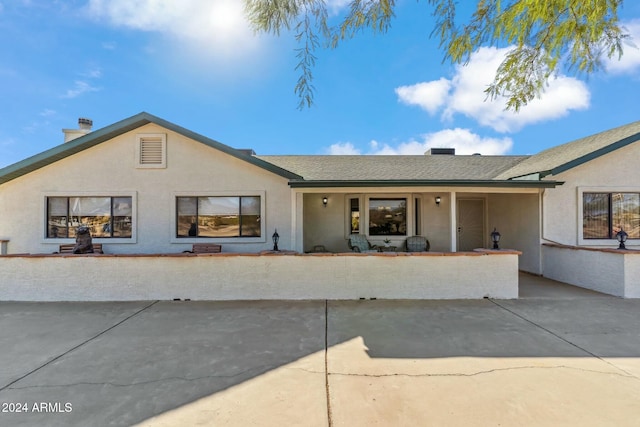 ranch-style house with a patio