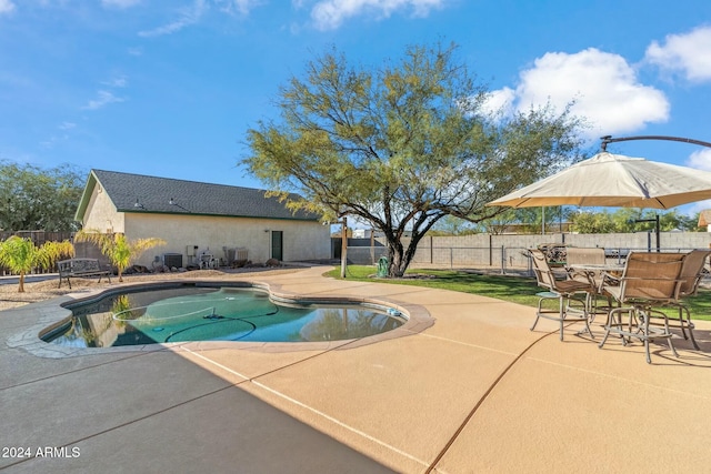 view of pool with a patio area and central air condition unit