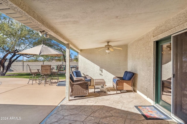 view of patio / terrace with ceiling fan and an outdoor hangout area