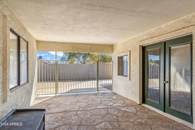 unfurnished sunroom with a wealth of natural light