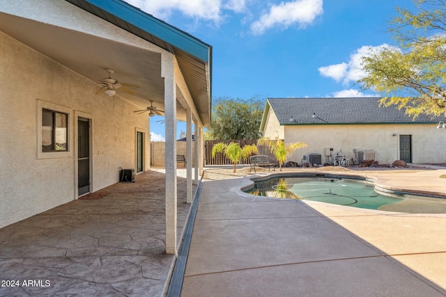 view of swimming pool with central AC, ceiling fan, and a patio area