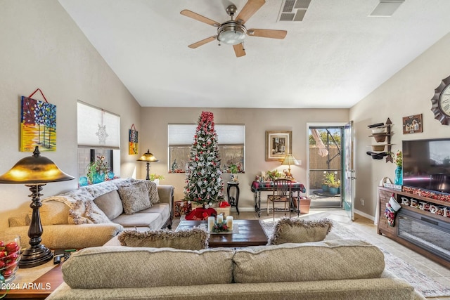 tiled living room featuring vaulted ceiling and ceiling fan