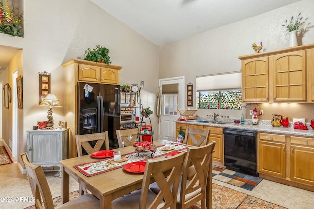 kitchen featuring black appliances, light tile patterned flooring, sink, and high vaulted ceiling