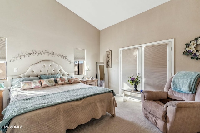 bedroom featuring light colored carpet, high vaulted ceiling, and multiple windows