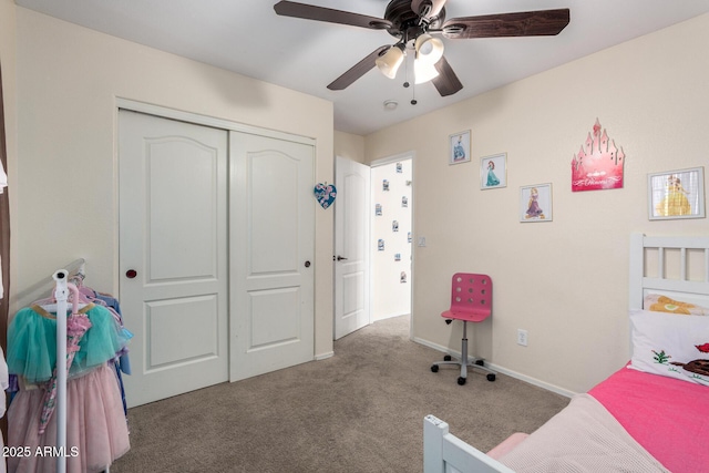 carpeted bedroom featuring ceiling fan and a closet