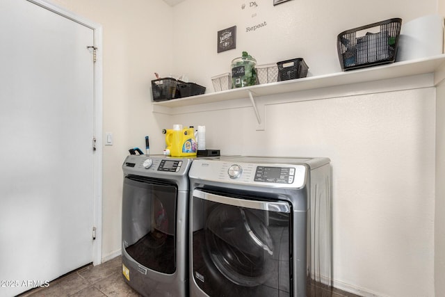 washroom with separate washer and dryer and light tile patterned flooring