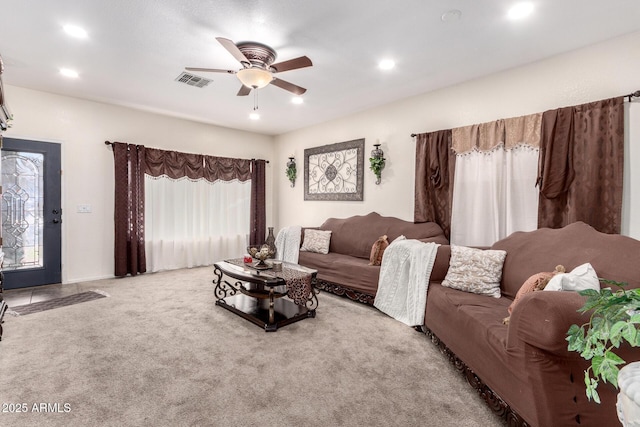 living room with carpet and ceiling fan