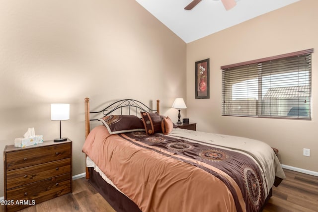 bedroom with lofted ceiling, dark hardwood / wood-style floors, and ceiling fan