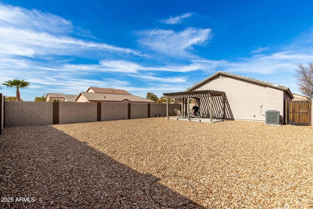 rear view of property featuring cooling unit, a pergola, and a patio area