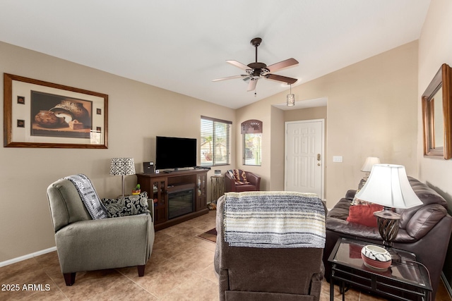 tiled living room with vaulted ceiling and ceiling fan