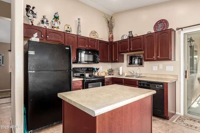 kitchen with sink, light tile patterned flooring, black appliances, and a kitchen island