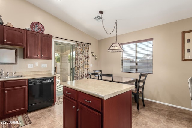 kitchen with vaulted ceiling, decorative light fixtures, dishwasher, sink, and a center island