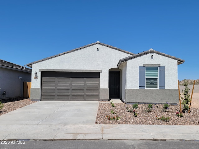 3550 N Camden Dr, Florence, AZ 85132 - mediterranean / spanish-style home with driveway, an attached garage, and stucco siding