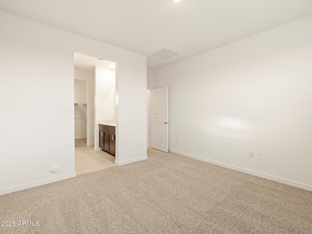 3550 N Camden Dr, Florence, AZ 85132 - unfurnished bedroom featuring light carpet and ensuite bath
