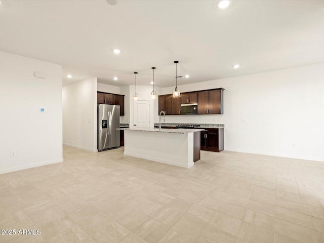 3550 N Camden Dr, Florence, AZ 85132 - kitchen featuring appliances with stainless steel finishes, recessed lighting, open floor plan, dark brown cabinetry, and a kitchen island with sink
