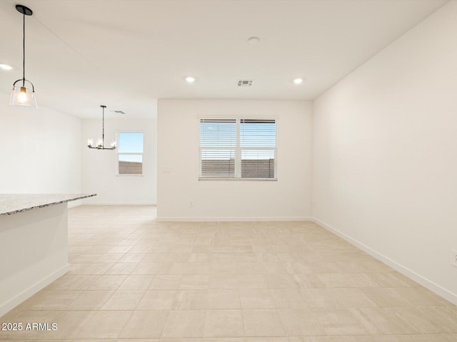 3550 N Camden Dr, Florence, AZ 85132 - spare room featuring a chandelier and recessed lighting