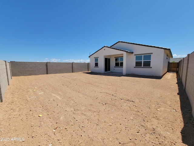 3550 N Camden Dr, Florence, AZ 85132 - rear view of property with a fenced backyard and stucco siding