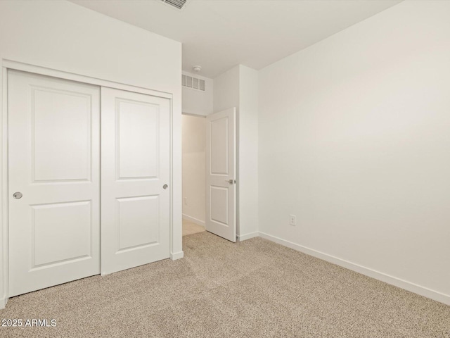 3550 N Camden Dr, Florence, AZ 85132 - unfurnished bedroom featuring light colored carpet and a closet