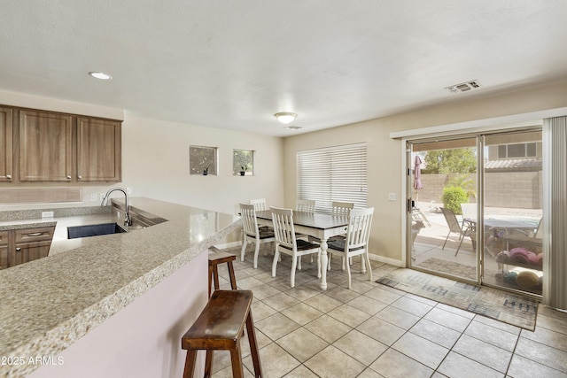 1072 W Windhaven Ave, Gilbert, AZ 85233 - dining space featuring baseboards, light tile patterned flooring, and recessed lighting