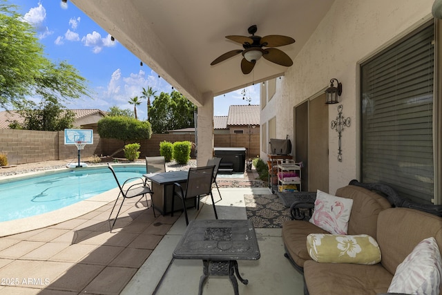 1072 W Windhaven Ave, Gilbert, AZ 85233 - fenced backyard with a hot tub, a patio area, a ceiling fan, and outdoor dining space