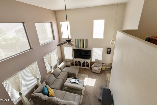 1072 W Windhaven Ave, Gilbert, AZ 85233 - carpeted living area featuring ceiling fan and a high ceiling